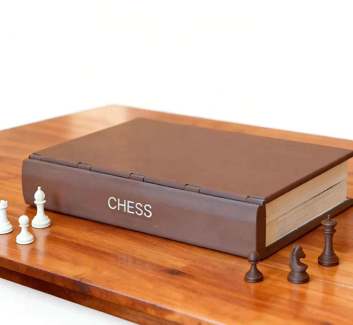 ChessBook sitting on a bookshelf disguised as a stylish book